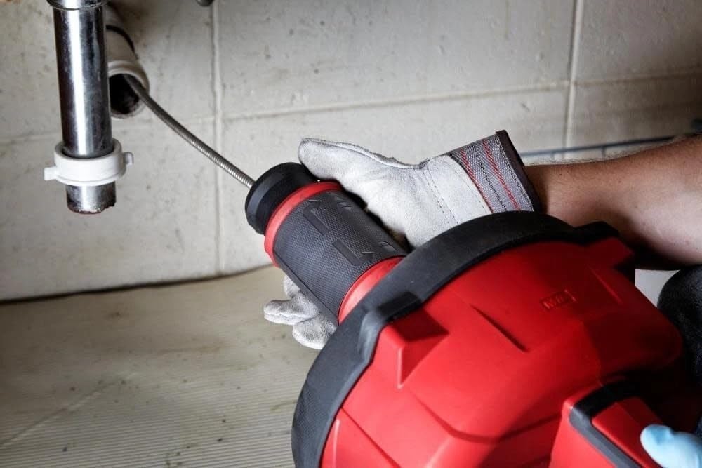 Milwaukee M18 drain snake review real-world details not found in the official specs including noise level battery life and cable behavior under load
